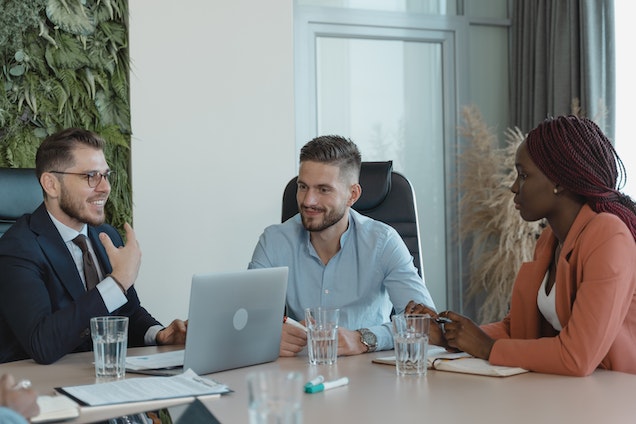 three property managers looking over a tenants applications in a conference room